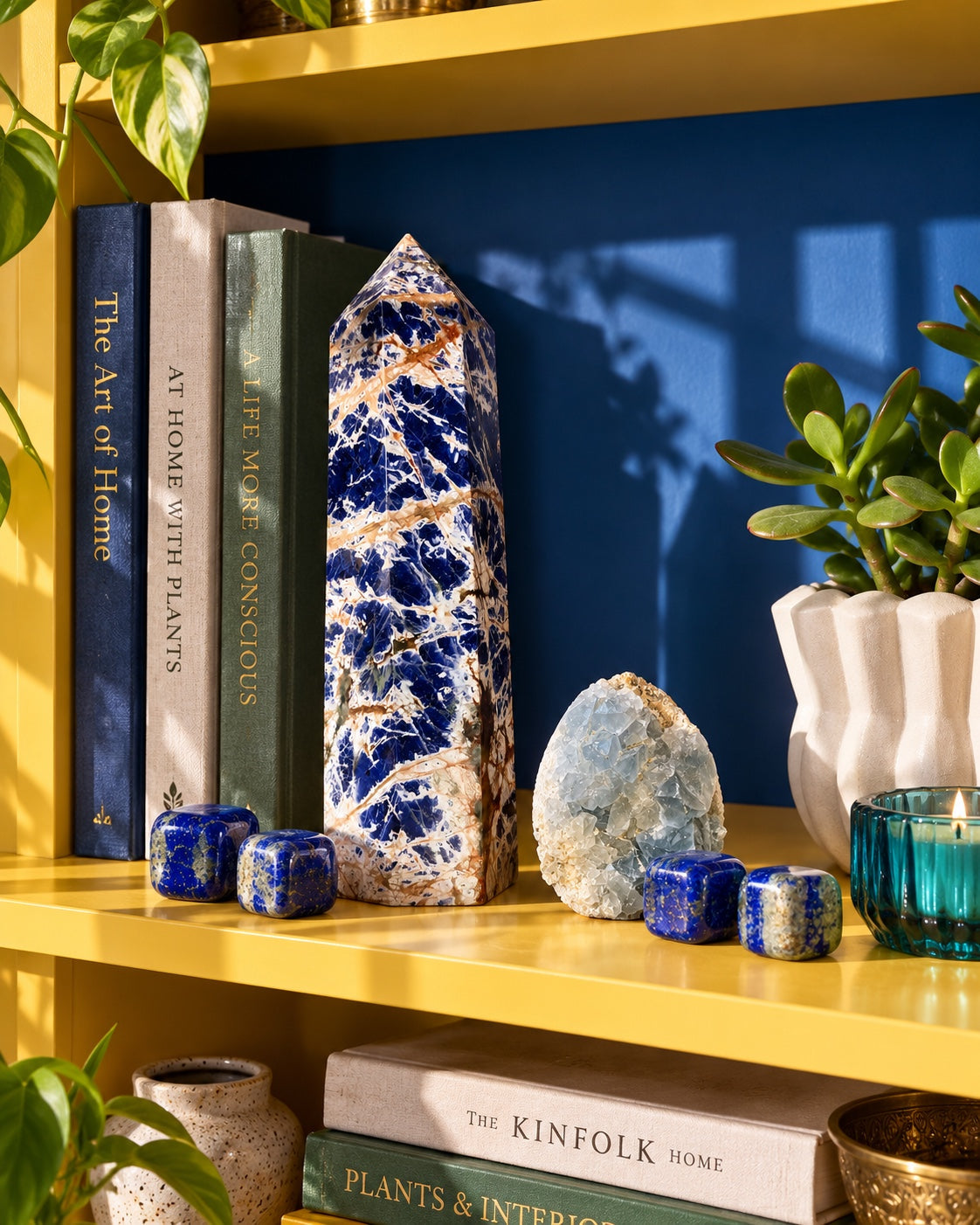Blue crystals displayed on yellow shelving.